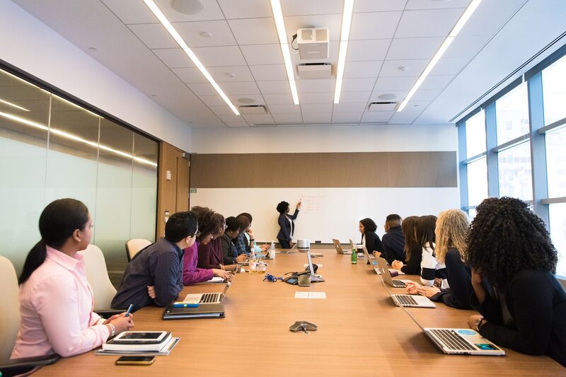 Brand partners reviewing campaign results around a boardroom table