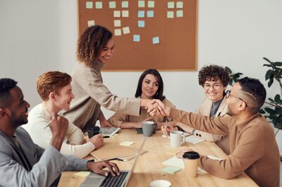 Sales team gathered around a table for a campaign briefing